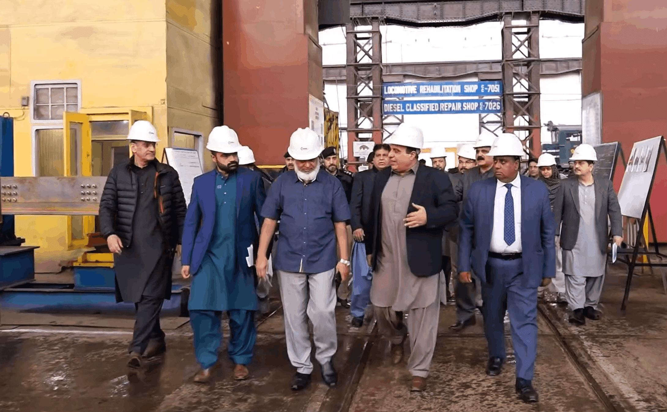 This screengrab shows Bangladesh’s Secretary for International Organizations, Farhad Islam, and High Commissioner to Pakistan Mohammad Iqbal Hussain Khan visiting the Pakistan Railways Workshop Division in Lahore on February 7, 2026. (Pakistan Railways)