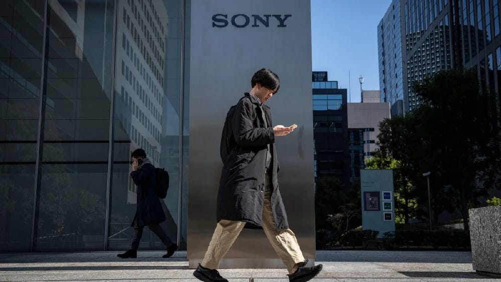 People walk past the Sony headquarters in Tokyo on February 10, 2025. (Photo: AFP/File)