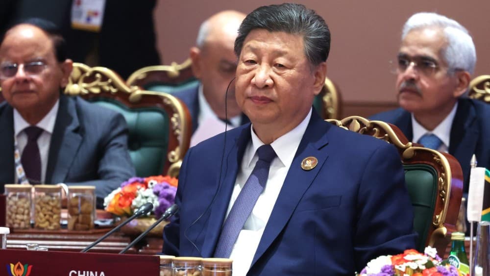 In this pool photograph distributed by the Russian state agency Sputnik, China's President Xi Jinping attends the 18th BRICS Summit in New Delhi on September 13, 2026. (Photo by Alexander KAZAKOV / POOL / AFP)