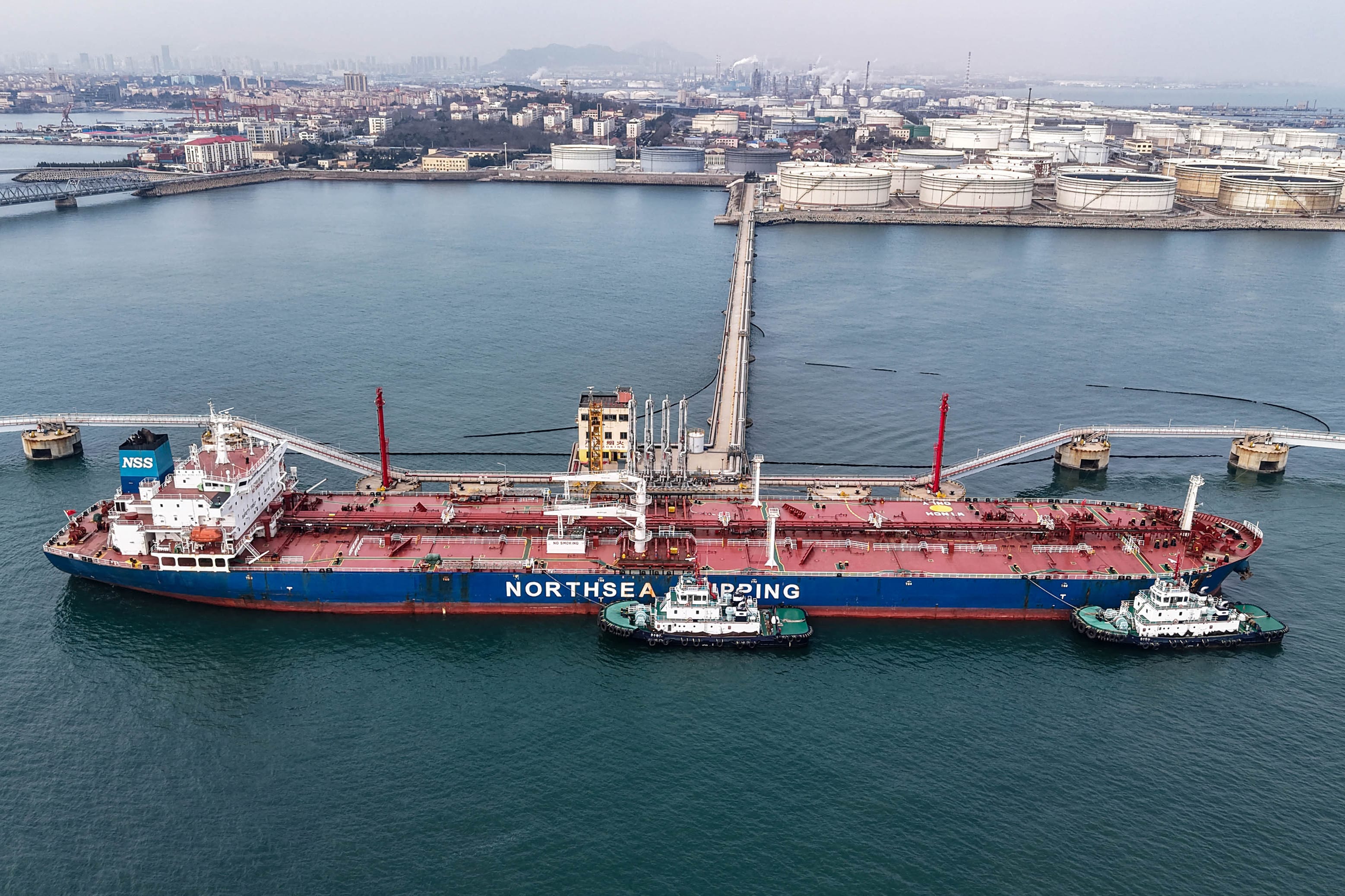 An oil tanker unloads crude oil at a terminal at the port in Qingdao, in China’s eastern Shandong province, on March 11, 2026. (Photo: AFP)