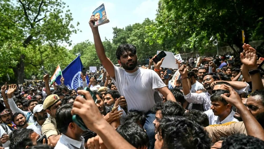 Cockroach Janta Party (CJP) founder Abhijeet Dipke (C) takes part in a protest over alleged irregularities in the country's major examinations, in New Delhi on June 6, 2026. (File photo: AFP)