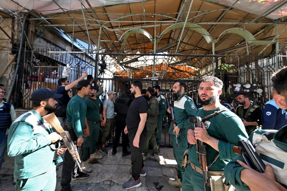 Bomb blast at Damascus cafe kills nine, authorities say