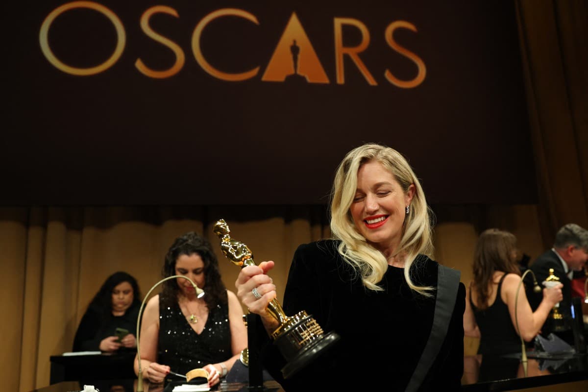 US producer Sara Murphy holds her Oscar for Best Picture for "One Battle After Another" as she attends the 98th Annual Academy Awards Governors Ball at the Dolby Theatre in Hollywood, California on March 15, 2026. (AFP)