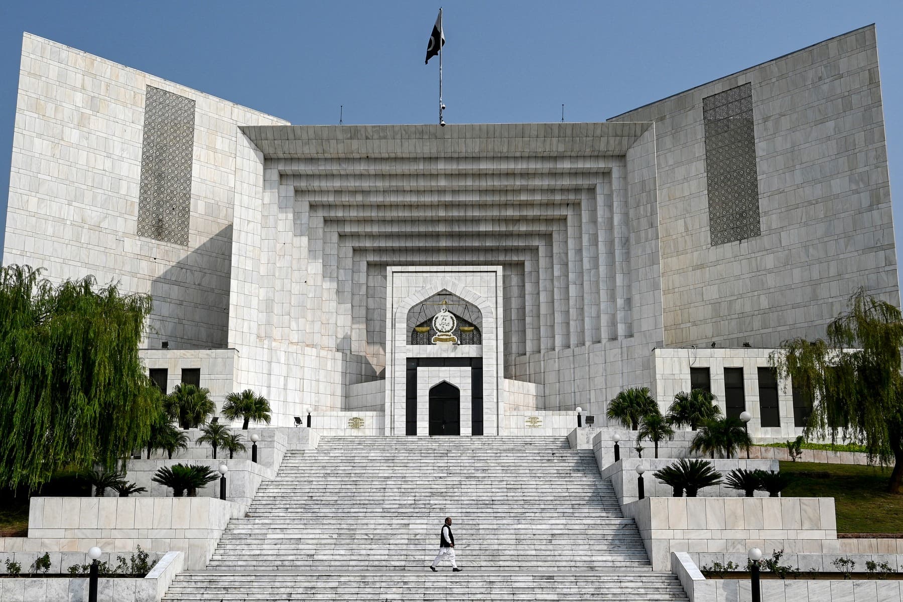 A man walks past the Pakistan's Supreme Court building in Islamabad on October 23, 2024.