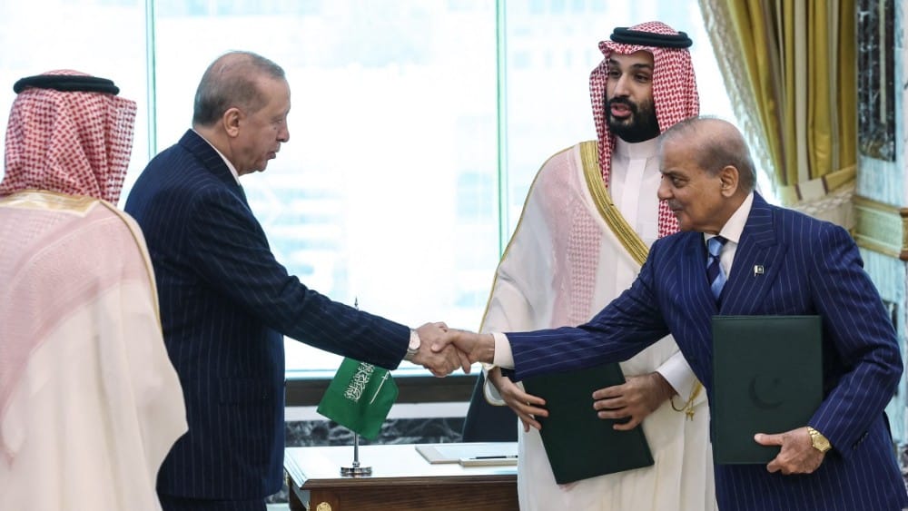This handout photograph taken and released by the Turkish Presidency press office on August 7, 2026, shows Turkey's President Recep Tayyip Erdogan (L) shaking hands with Pakistan’s Prime Minister Shehbaz Sharif as Saudi Arabia's Crown Prince Mohammed bin