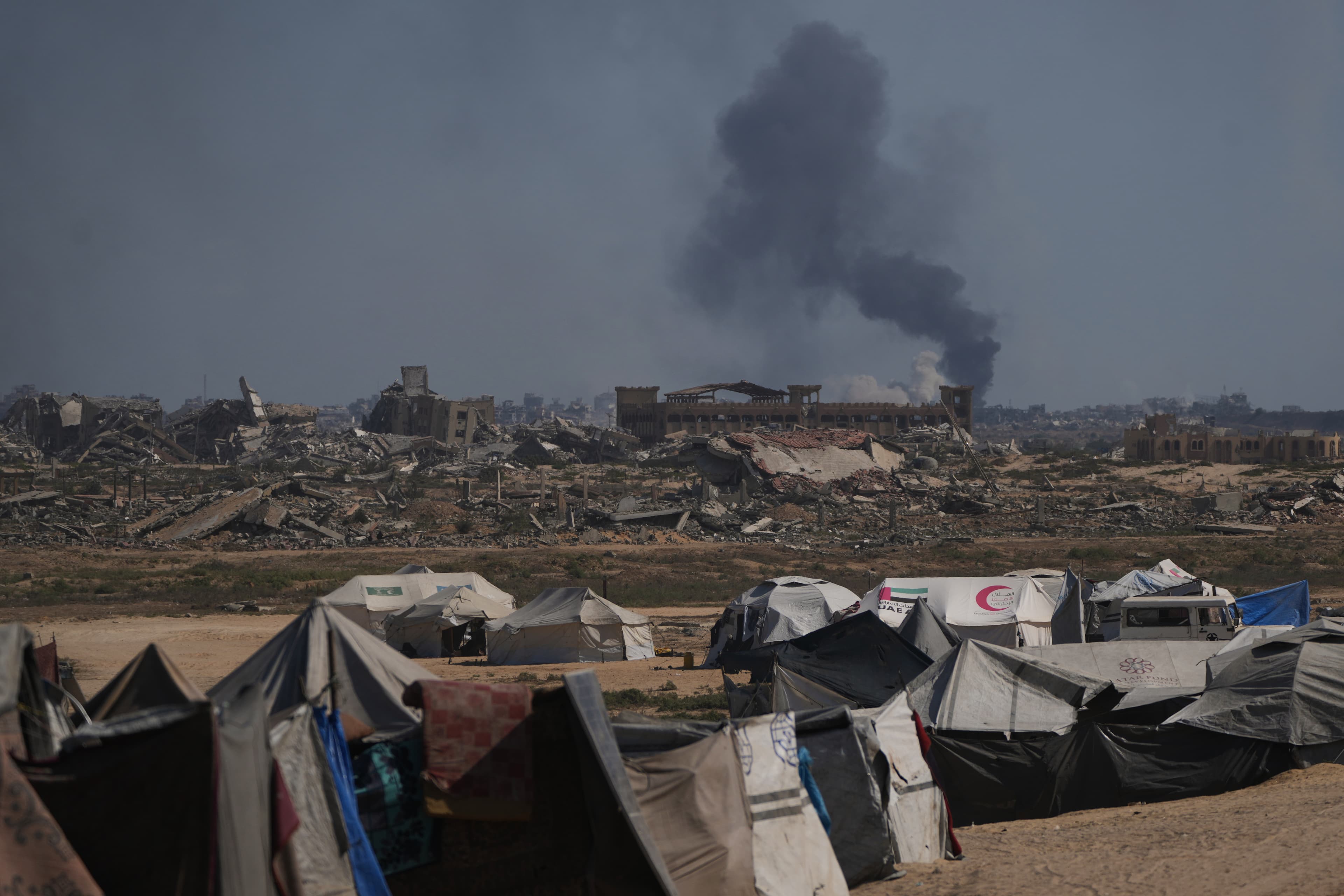 Smoke rises to the sky following an Israeli military strike in Gaza City, as seen from the central Gaza Strip, Thursday, Oct. 2, 2025. (AP Photo/Abdel Kareem Hana)