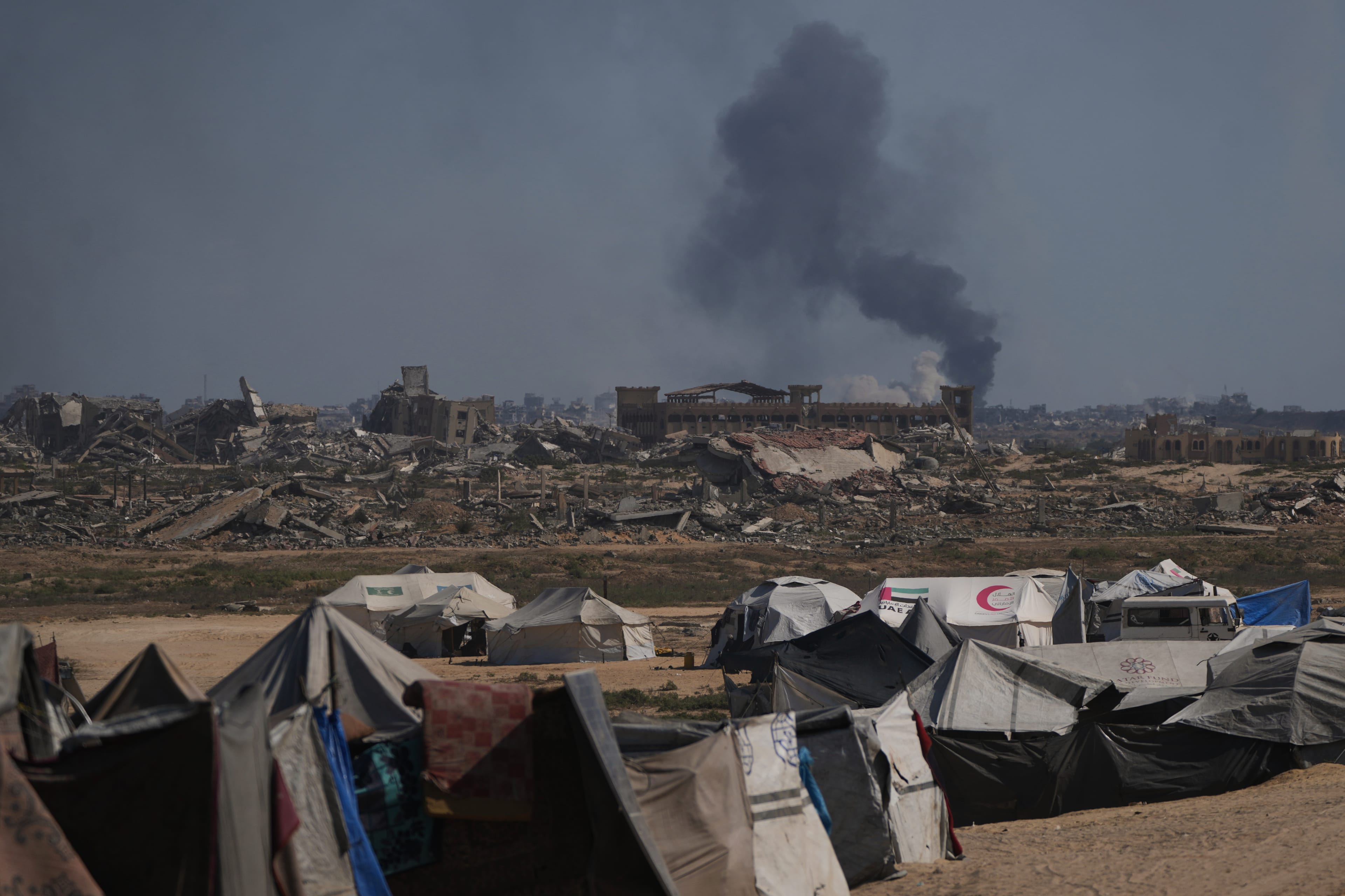 Smoke rises to the sky following an Israeli military strike in Gaza City, as seen from the central Gaza Strip, Thursday, Oct. 2, 2025. (AP Photo/Abdel Kareem Hana)
