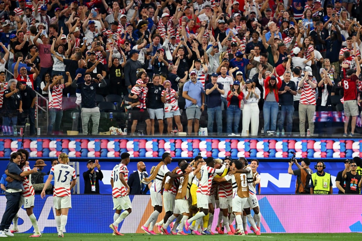 US midfielder #07 Giovanni Reyna celebrates with teammates after scoring his team's fourth goal during the 2026 World Cup Group D football match between USA and Paraguay at the Los Angeles Stadium in Inglewood on June 12, 2026. (Photo by Patrick T. Fallon