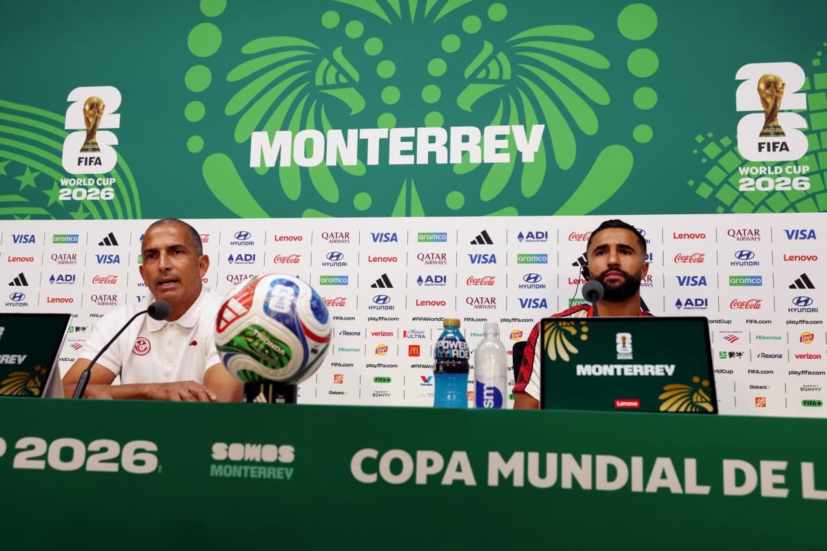 Tunisia's French head coach Sabri Lamouchi (L) and defender #02 Ali Abdi give a press conference on the eve of Tunisia's 2026 World Cup football tournament Group F football match against Sweden at Monterrey Stadium in Monterrey, Mexico, on June 13, 2026.
