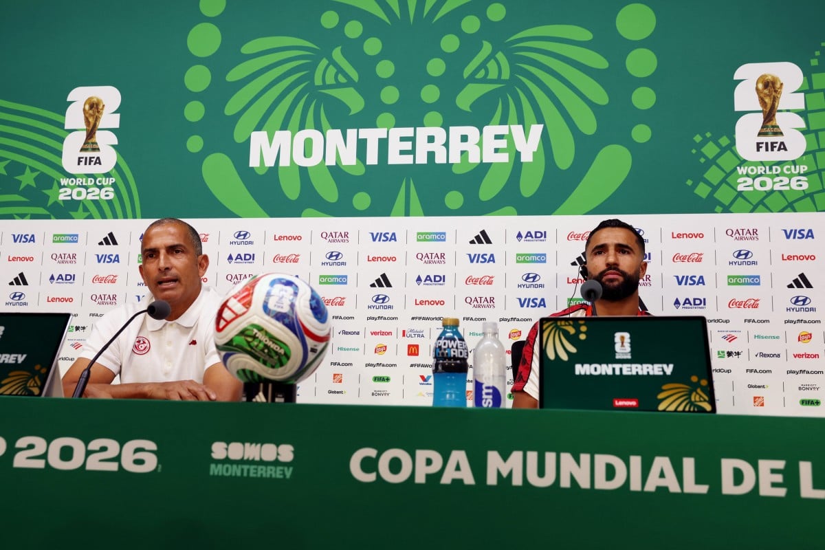 Tunisia's French head coach Sabri Lamouchi (L) and defender #02 Ali Abdi give a press conference on the eve of Tunisia's 2026 World Cup football tournament Group F football match against Sweden at Monterrey Stadium in Monterrey, Mexico, on June 13, 2026.