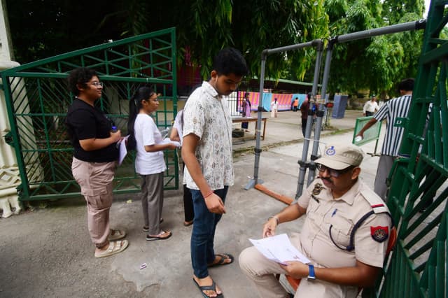 Police personnel check documents of medical students before the NEET-UG re-examination in Guwahati, India, on June 21, 2026. (AFP)