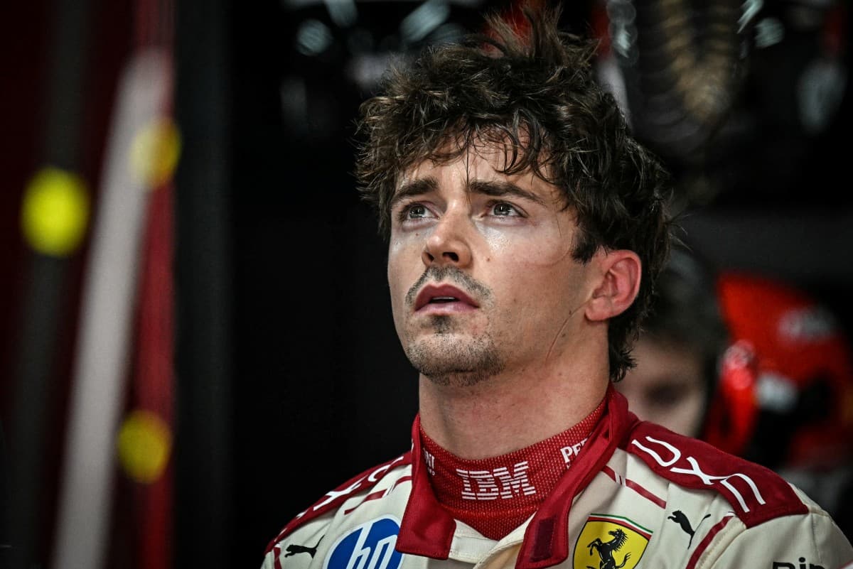 Ferrari's Monegasque driver Charles Leclerc reacts in the garage as he looks at the results after taking part in the first practice session at the Monaco street circuit in Monaco, ahead of the Monaco Formula 1 Grand Prix, on June 5, 2026. (Photo by Gabrie