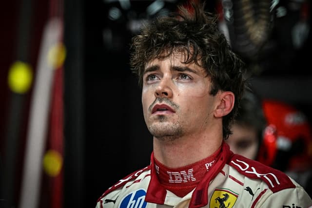 Ferrari's Monegasque driver Charles Leclerc reacts in the garage as he looks at the results after taking part in the first practice session at the Monaco street circuit in Monaco, ahead of the Monaco Formula 1 Grand Prix, on June 5, 2026. (Photo by Gabrie