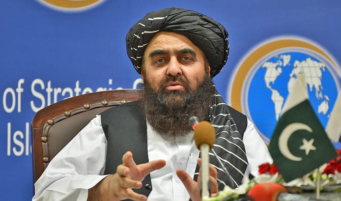 Afghanistan's Foreign Minister Amir Khan Muttaqi gestures while speaking during an event held in the Institute of Strategic Studies in Islamabad, Pakistan. (AFP/File)