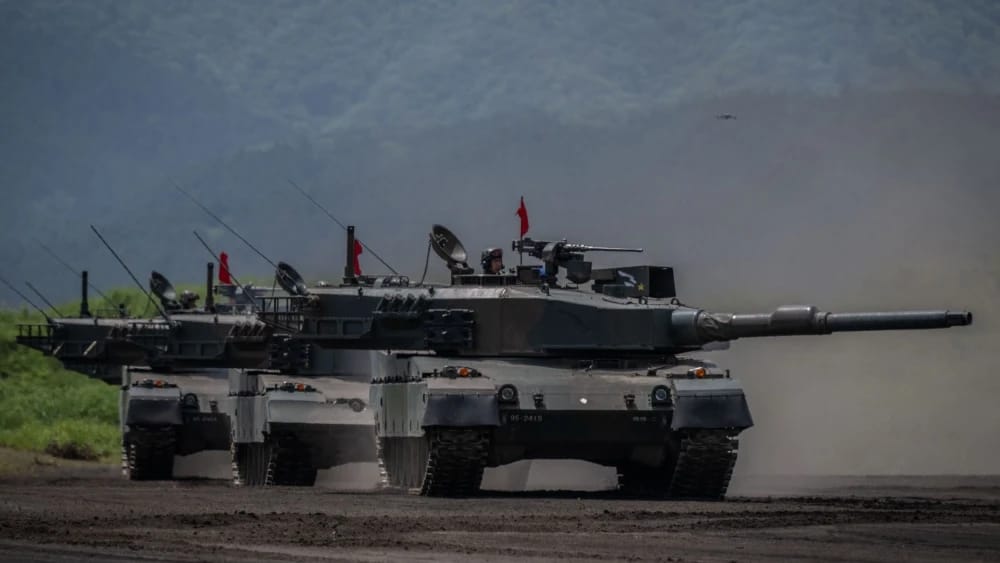 Japan Ground Self-Defence Force (JGSDF) battle tanks take part in a live fire exercise at East Fuji Maneuver Area in Gotemba on May 27, 2023.