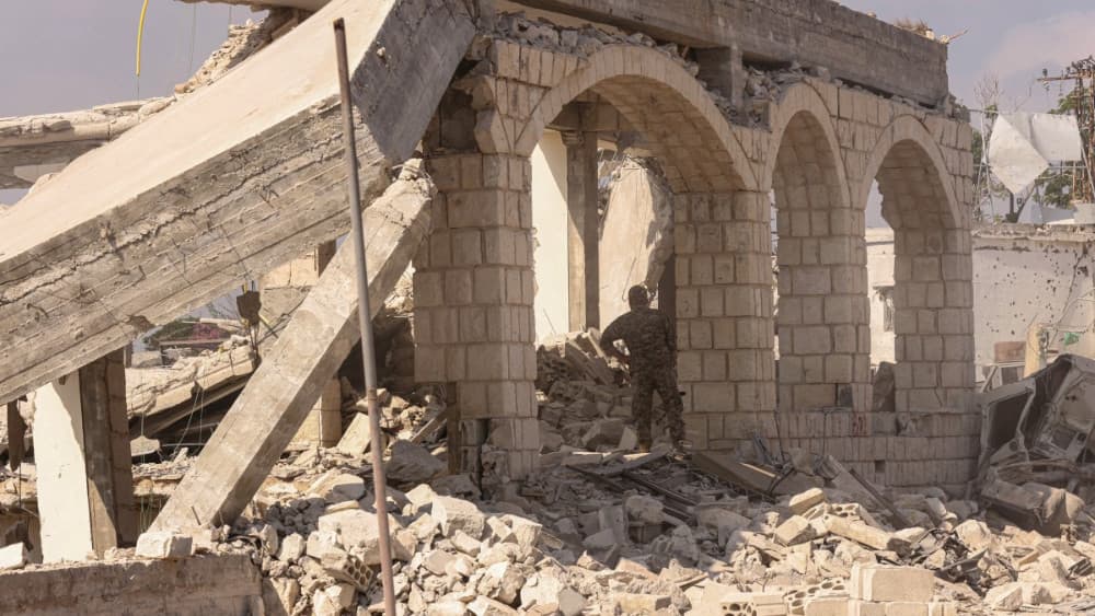 A Lebanese army soldier inspects destruction of a home by the Israeli military in the southern Lebanese village of Zawtar al-Gharbiyah on August 8, 2026. (AFP)