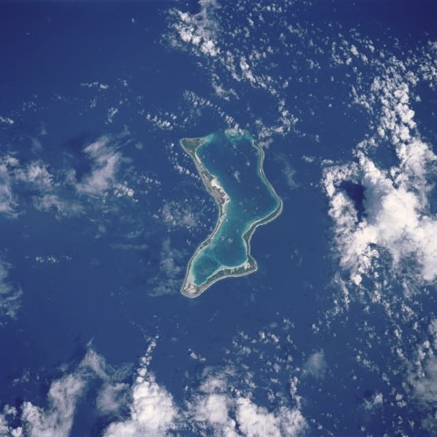Aerial view of Diego Garcia, the largest island in the Chagos Islands, which hosts a US-UK military base. (NASA)