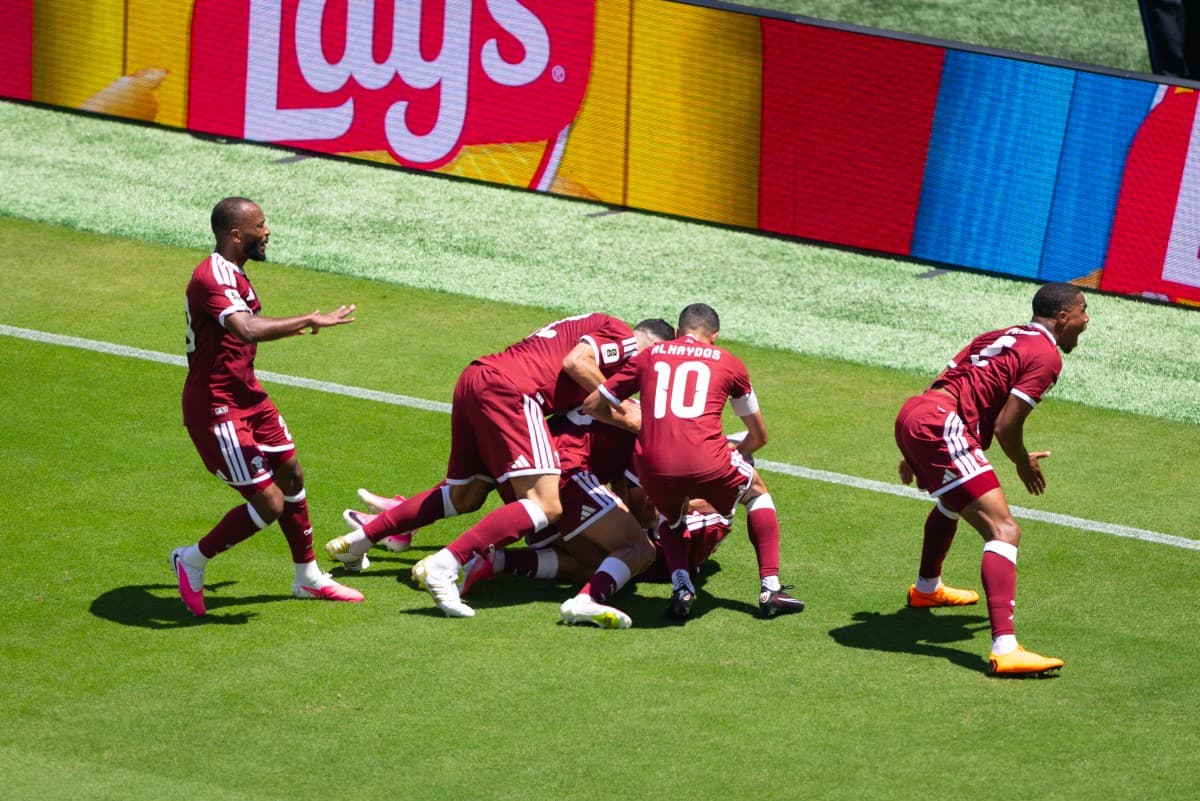 Qatar earn first ever World Cup point with late goal
