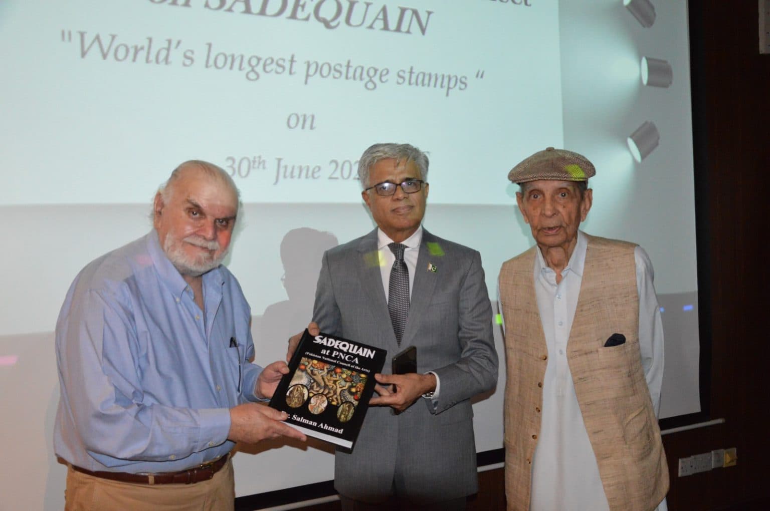 Founder of Gallery 21 Islamabad, Dr. Farrukh Seir received the special commemorative stamp from Director General Pakistan Post Sqn. Ldr. (R) Maqsood Ahmed during the ceremony, a presentation that reflected a shared commitment to preserving and celebrating