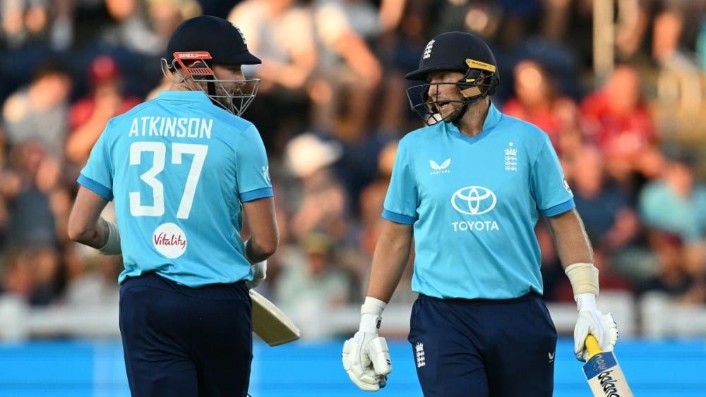 England's Gus Atkinson (L) and England's Joe Root react during the second one-day international (ODI) cricket match between England and India at Sophia Gardens in Cardiff, Wales on July 16, 2026.