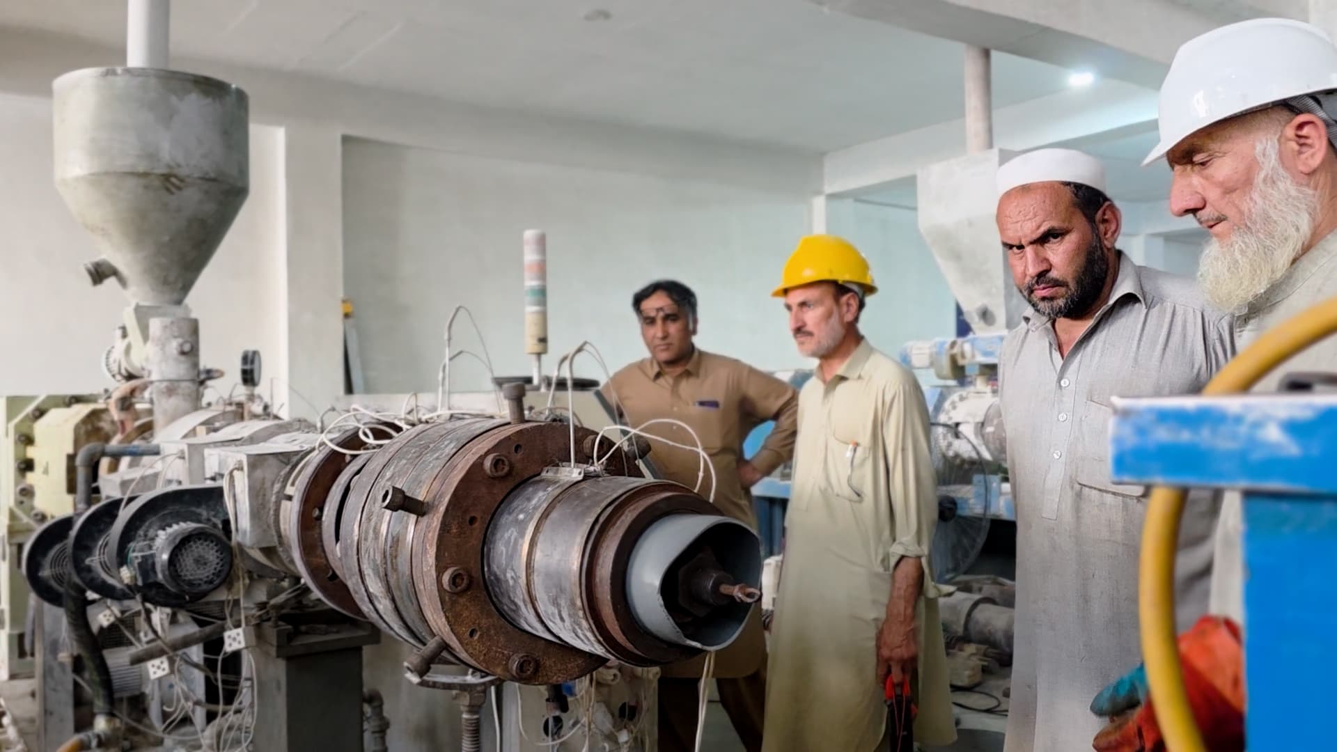 Workers at a pipe manufacturing factory in Peshawar on April 30th. (Photo: Pakistan TV Digital)