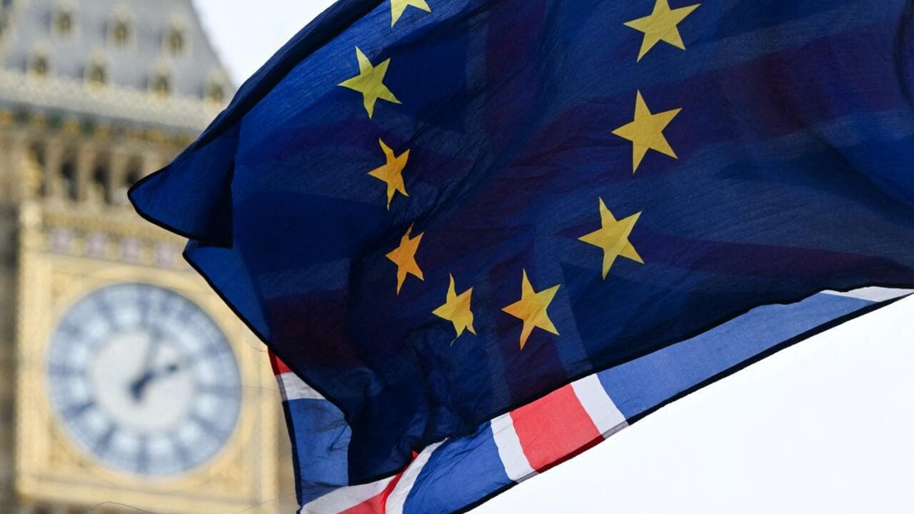 A photograph taken on January 31, 2024 shows a European Union flag flapping in the air in front of the Elizabeth Tower, commonly known by the name of the clock's bell "Big Ben", at the Palace of Westminster, home to the Houses of Parliament, central Londo