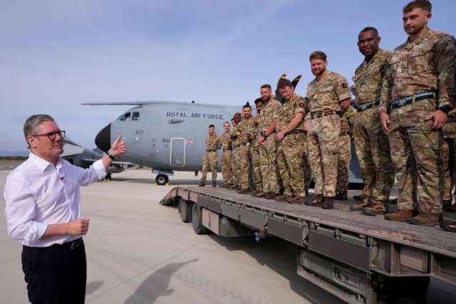 Britain's Prime Minister Keir Starmer talks to soldiers at the RAF base in Akrotiri on the southern coast of Cyprus on December 10, 2024. (AFP)