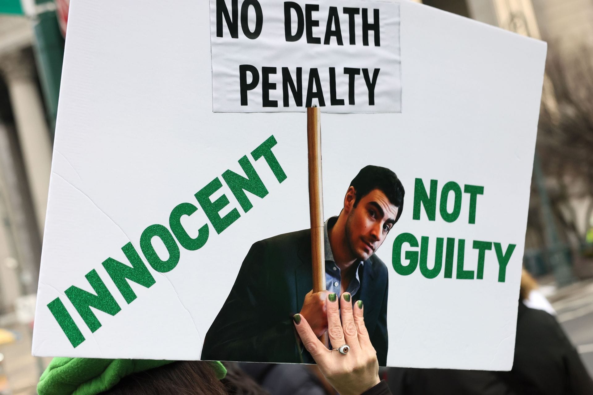 Supporters of Luigi Mangione wait in line to enter Manhattan Federal Court on January 09, 2026 in New York City. (AFP)
