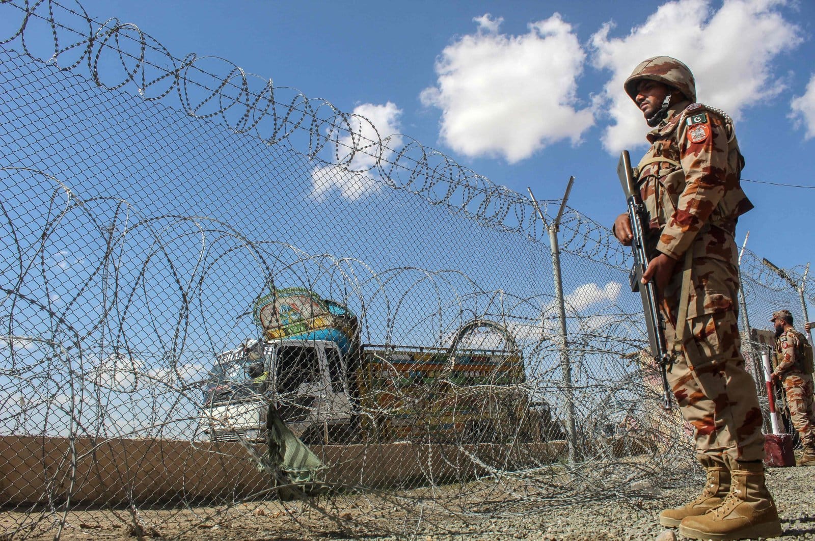 Pakistani soldiers keep watch at the Pakistan-Afghanistan border in Chaman, Balochistan province on March 19, 2026. (AFP)