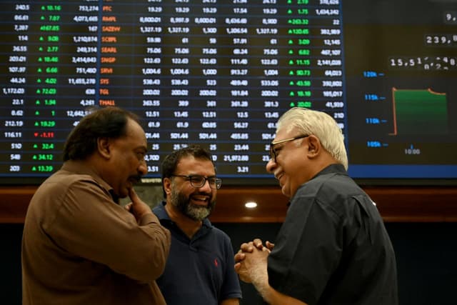 Stockbrokers interact during a trading session at Pakistan Stock Exchange (PSX) in Karachi on May 12, 2025. (AFP/File)