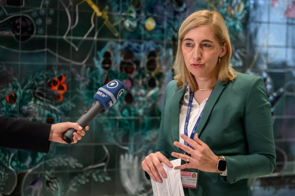 Germany's Health Minister Nina Warken speaks to a journalist after a meeting with World Health Organization (WHO) Director-General ahead of the 79th World Health Assembly in Geneva, on May 17, 2026. (Photo by Fabrice COFFRINI / AFP)