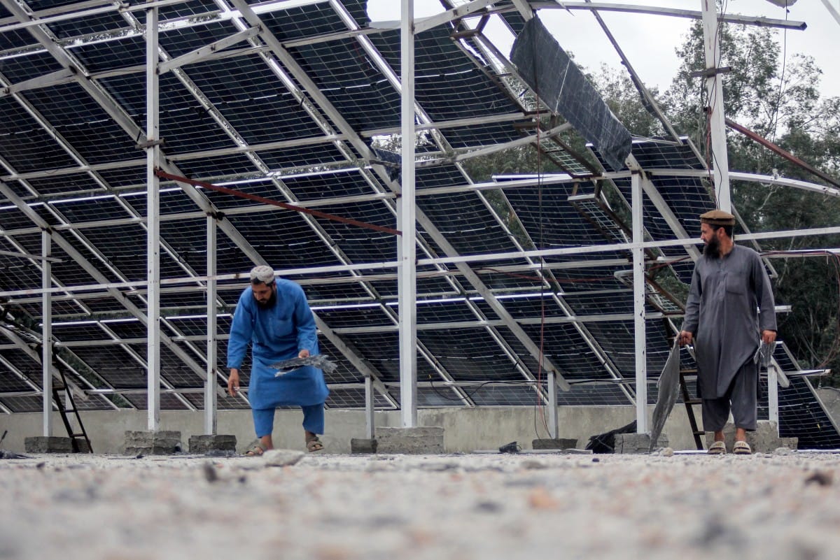Afghan men inspect the damaged rooftop of the Faculty of Education building at the Sayed Jamaluddin University in Asadabad, Kunar province. (AFP)